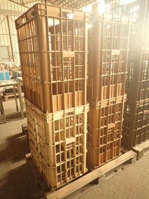 many wooden crates stacked on a pallet in a warehouse