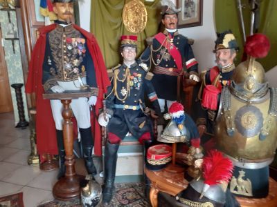 several figurines of men dressed in military uniforms are posed in a living room