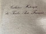 an old book with writing on it sitting on a table