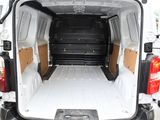 a white van that is parked in the parking lot