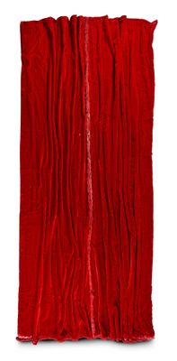 the red curtain is hanging on the wall next to the white wall