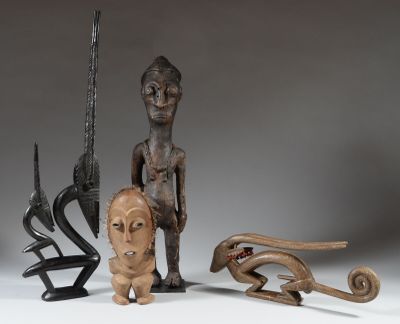 several wooden sculptures of different shapes and sizes on a white surface