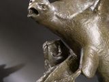 a statue of a bird that is on a table