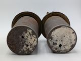 pair of old rusty oil canisters on a white background