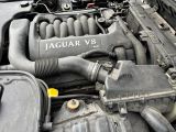 the engine of a car with its hood open and the hood down