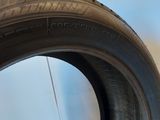 a close up of a tire on a white surface