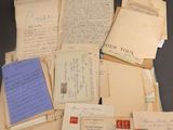 several old letters and envelopes sitting on top of a table