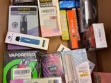 a cardboard box full of electronic devices and accessories