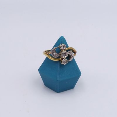 a close up of a ring with a diamond on top of a blue box