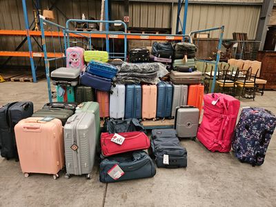 many pieces of luggage that are sitting on the ground