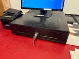 a computer sitting on top of a red desk