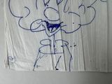 a drawing of a man with a hat and tie on a piece of paper