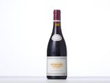 a bottle of wine that is sitting on a table