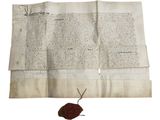 une feuille de papier sur laquelle est apposé un cachet de cire