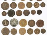 an image of a collection of old coins on a white surface