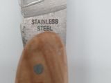 a knife that has a wooden handle on it