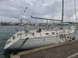a white sailboat that is docked in the water