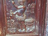 an old wooden frame with a picture of a woman on it
