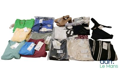 a pile of clothing that is sitting on a white surface