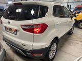the rear end of a white ford escape parked in a garage