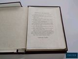 an open book with a poem in it on a table