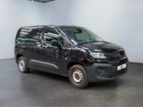 a picture of a black van parked in a garage