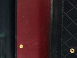 three black and red wallets lined up against each other