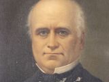 portrait of a man in a suit and bow tie in a gold frame