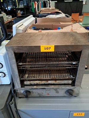 an oven that is sitting on a table in a room