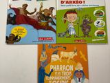 trois livres pour enfants sont posés sur une surface blanche