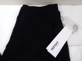 the pants are black and have a white tag on them
