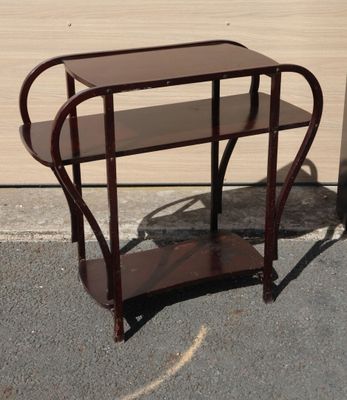 a small wooden table with a shelf on top of it