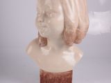 a statue of a woman with a cigarette coming out of her mouth