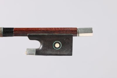 a close up of a violin bow on a white background