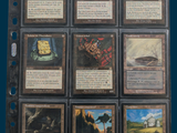 a lot of cards that are in a binder