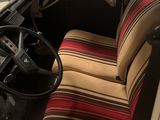 a picture of the interior of a car with a steering wheel