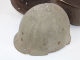 two helmets sitting on a table next to each other