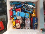 a box full of toy cars sitting on a table