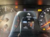a close up of a car dashboard with various gauges and numbers