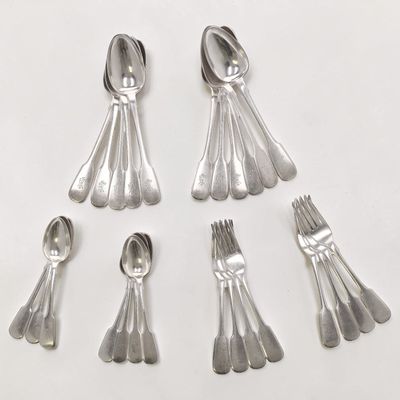 six silver spoons and six silver spoons on a white surface