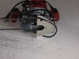 a small machine that is sitting on top of a piece of paper
