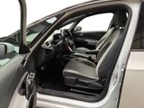 the interior of a car with the door open and the driver ' s seat down