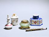 a small collection of miniature objects sitting on a table