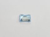 a square blue topazte stone on a white surface