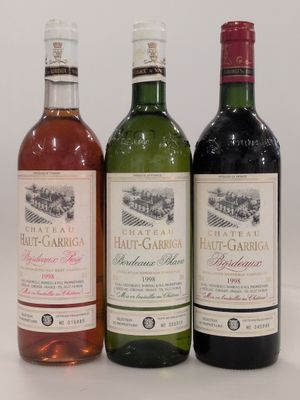 three bottles of wine sitting next to each other on a table