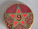 an image of a red and green star on a red background