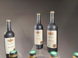 several bottles of wine are lined up on a table