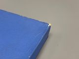 a close up of a blue book on a table