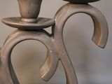 two candles that are sitting on top of each other