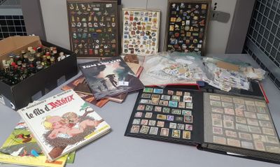 a table with a lot of stamps and books on it